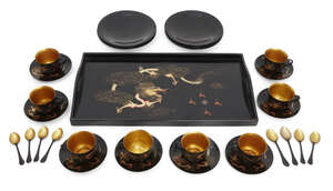 
	
		A Chinese painted lacquer coffee set, 20th century, comprised of eight cups and saucers...