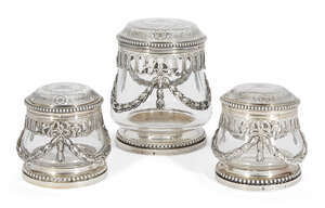 
	
		A set of three French silver mounted glass vanity jars by André Aucoc (1877-1911), Paris,...