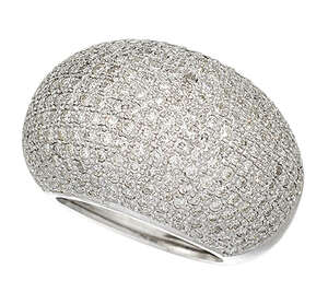 
	
		A diamond bombe ring, the domed bezel pave-set with circular-cut diamonds to a tapering...