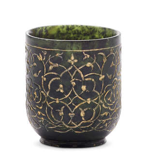 
	
		A Timurid-style incised spinach green jade cup with gilded decoration, of cylindrical...