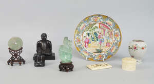 
	
		A Chinese pale green and clear hardstone model of Guanyin, on a wooden stand, 13cm high,...