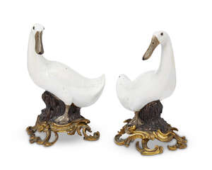 A pair of large Chinese export porcelain ducks, 18th/19th century, modelled standing on brown-glazed naturalistic base, mounted on gilt bronze rococo scroll ba