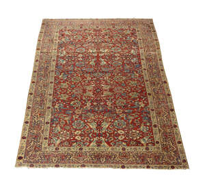 
	
		An antique Isfahan carpet, late 18th/early 19th century, the claret coloured field with...