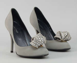 
	
		A pair of Sergio Rossi silver grey stilettos, with crystal studded bow detail, size 38...