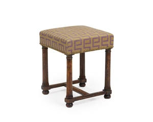 An English oak foot stool, first quarter 20th century,&nbsp;with recent upholstery, on cylindrical...