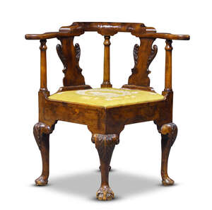 
	
		A George I walnut and yew wood corner armchair, c.1720, the back with a pair of foliate...