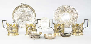 
	
		A set of four Russian silver niello and gilt tea glass holders, 20th century, with...