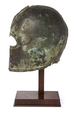 
	
		A Greek bronze Corinthian partial helmet, Archaic period, circa 2nd half of the 7th...