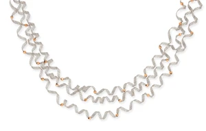 A multi-row chain necklace, composed of three coiled mesh chain lengths, with facetted ball...