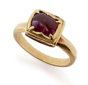 
	
		A ruby set square gold ring, South India, 19th century or earlier, the polished ruby...