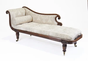 A William IV mahogany chaise lounge, second quarter 19th century, the shaped padded back with...