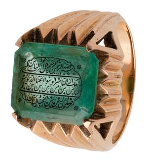 
	
		An inscribed emerald set into a gold ring, India, 20th century, the emerald of...