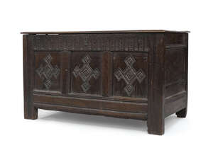 
	
		An oak coffer, 17th century and later, with hinged top above a three-panelled front and...