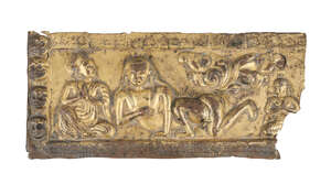 
	
		A Tibetan gilt copper repousse plaque, 16th century, decorated with a reclining deity...