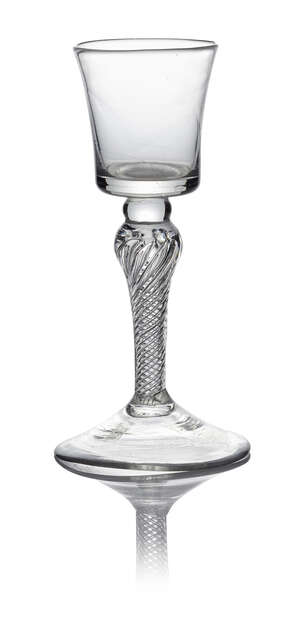 A George II wine glass, c. 1755, with square bucket bowl above a multi-spiral air twist stem with shoulder knop, on conical foot, 15.5cm high