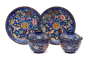 
	
		A pair of Chinese Canton enamel bowls with covers and stands, early 19th century, each...