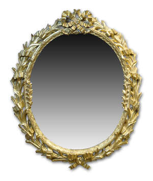 A French giltwood wall mirror, c.1850, the oval plate within a foliate and bull rush carved...
