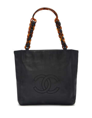 
	
		Chanel: a small black leather tote bag, with faux tortoiseshell handles and chain with...
