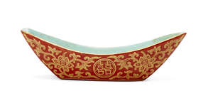 
	
		A Chinese porcelain boat-shaped dish, Jiaqing mark and of the period, gilt-painted on a...