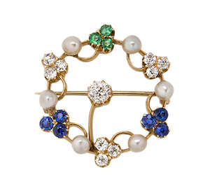 
	
		An Edwardian gold, diamond, sapphire and emerald garland brooch, composed of two sapphire...
