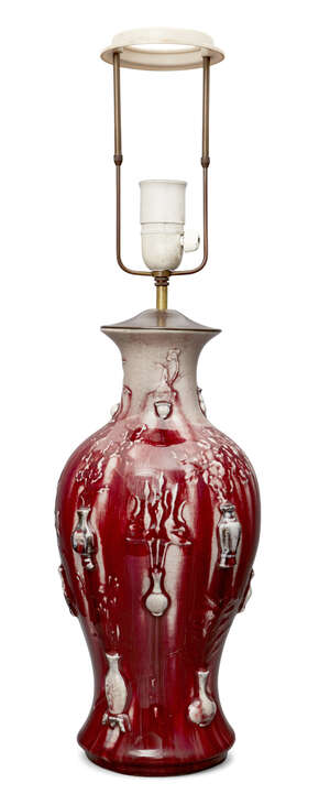A Chinese porcelain sang de boeuf baluster vase, Tongzhi period, with moulded decoration of various vases of flowers, unmarked, 38cm high
		Provenance: The Jo