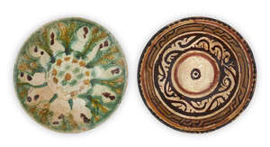
	
		Two Nishapur conical pottery bowls, Iran, 10th century, the first underglaze painted in...