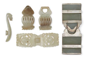 
	
		Three Chinese jade two-piece belt buckles and a garment hook, 18th-19th century, one of...