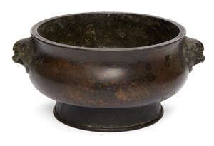 
	
		A Chinese bronze bombe censer, Xuande mark, late Qing dynasty, cast with Buddhist lion...