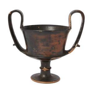 
	
		An Etruscan Bucchero Black glazed Kantharos, circa 600-550 B.C., with looped strap...