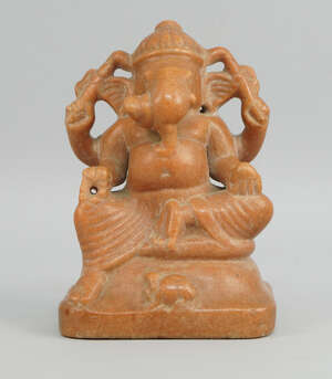
	
		An Indian pink marble model of Ganesh, 19th century, seated on a dias, with his rat at...
