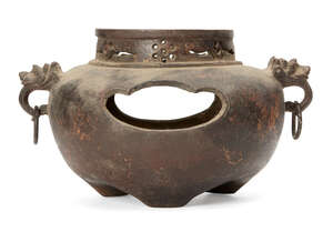 
	
		A Japanese cast iron parcel gilt censer, late 19th century, cast with dragon mask and...