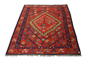 
	
		An Anatolian Kilim, late 19th/ early 20th century, the central panel with urn and column...