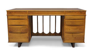 
	
		Alan Peters (1933-2009), a Devon walnut and rosewood desk, 1989, two pedestals of four...