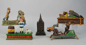 
	
		A collection of cast iron money banks, Hubley style, 20th century, to include Artillery...
