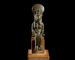 A small Egyptian bronze figure of a seated lion-headed Sekhmet,Late Period, circa 664-525...