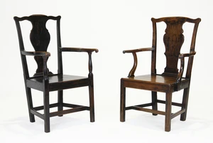 Two George III Provincial oak open armchairs, third quarter 18th century, with vasiform back...