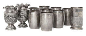 
	
		Eight Indian barrel beakers, seven stamped T100 for silver, each designed as a barrel and...