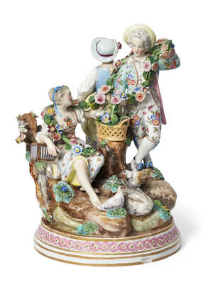 
	
		A Continental Meissen style porcelain figure group, late 19th century,  set in a natural...