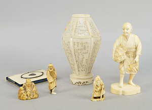
	
		A Japanese ivory figure of a man carrying a basket, holding an axe in his left hand, on a...