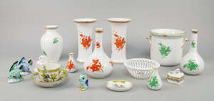 A pair of Herend porcelain Krater vase, late 20th century, decorated with red ochre flowers, 17cm high, together with two bottle vases, one in a green colourwa