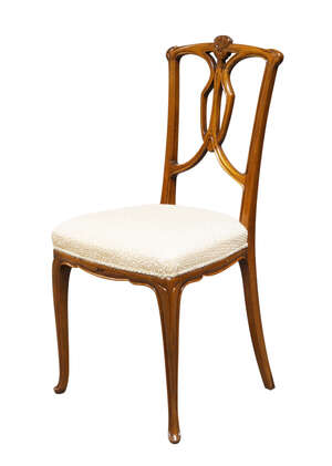 
	
		An Art Nouveau walnut upright chair 
		c.1900
		The back with carved sinuous floral...