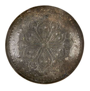 
	
		An inscribed Ghaznavid engraved metal dish, Iran, 11th century, of circular form, with...