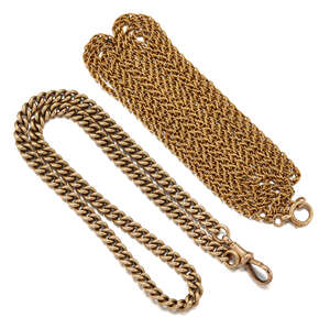 Two late 19th century gold chains, comprising: a curb link watch chain with clip terminal, 42.4g, length 42.5cm; and a fancy link guard chain, length 158.0cm, 