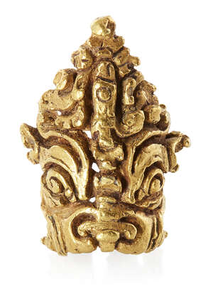 
	
		A Gupta gold hair ornament of Kirtimukha, India, 5th-8th century, in the form of a male...