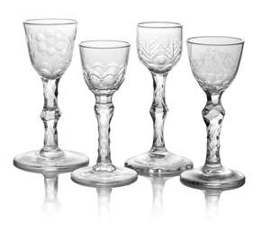 A George III drinking glass, the bowl engraved with flowers, on facetted cut stem, with circular foot, 15cm high, together with a glass engraved to the bowl wi