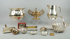 
	
		A miscellaneous collection of silver plate, to include wine cooler, meat platters, vases,...