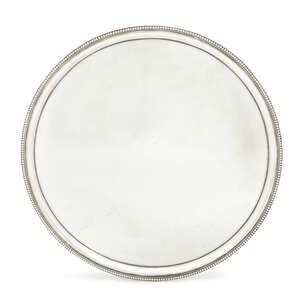 A George III silver salver, London c.1788, Thomas Hannam & John Carter (probably) of plain circular form, with moulded beaded border, raised on three splayed b