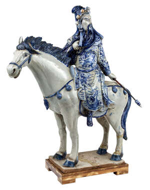 A large Chinese blue and white 'Guangong' statue, 20th century, with Guangong, one of the main...