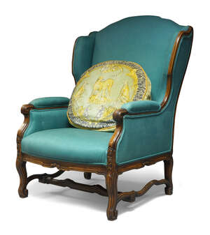 
	
		A blue upholstered wing back armchair, late 19th/early 20th century, hardwood frame, with...