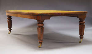 
	
		A large mahogany extending board room table, late 20th Century, the rounded rectangular...